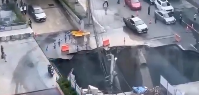 Traffic was disrupted after a section of a busy road in Thailand's capital, Bangkok, collapsed, creating a large sinkhole.