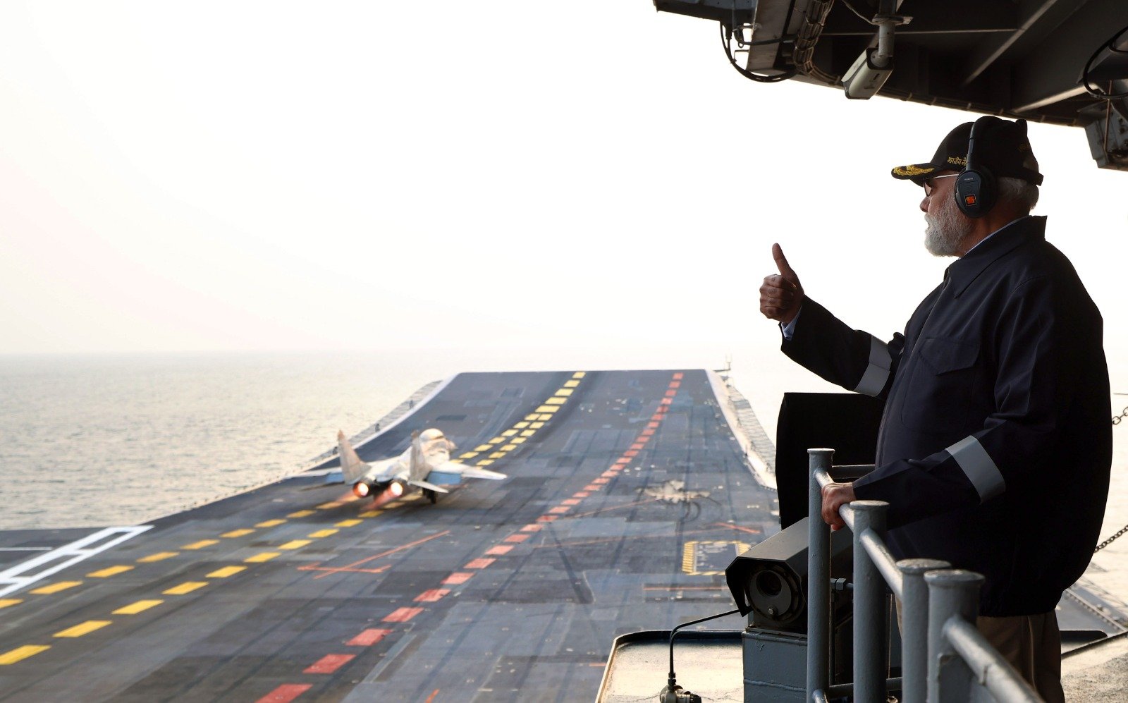 Indian Prime Minister Narendra Modi sees take-off and landing of a MiG-29 fighter jet on board INS Vikrant on Diwali 2025