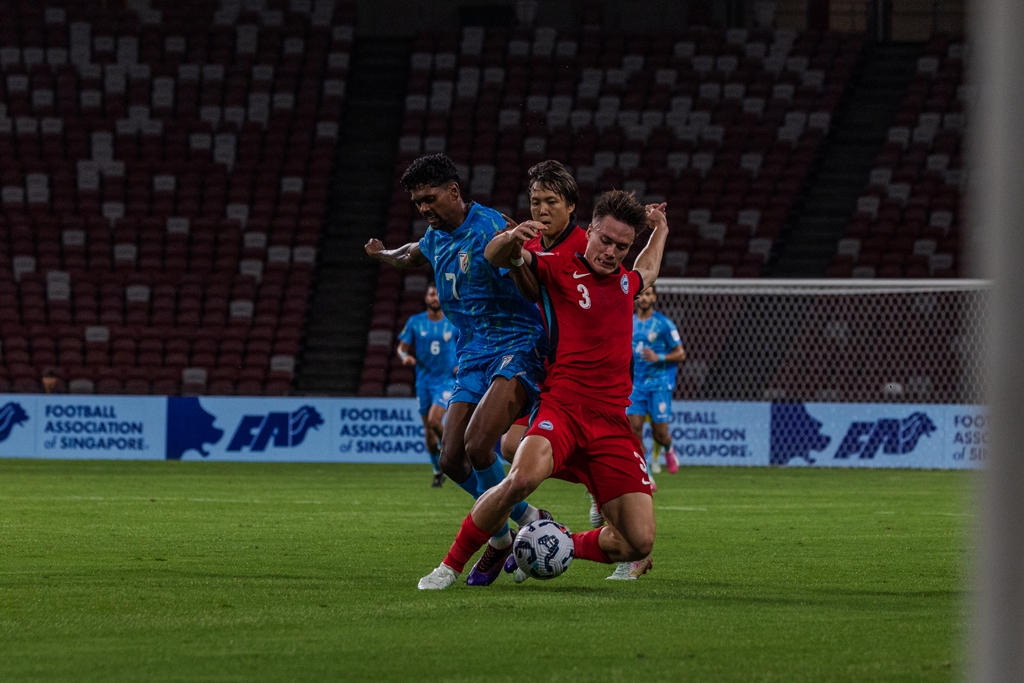 Singapore's Ryhan Stewart and Kyoga Nakamura and India's Liston Colaco fight for the possession. Photo courtesy: AIFF
