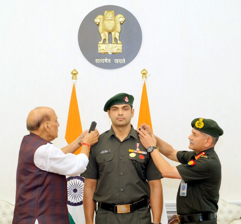 Indian Defence Minister Rajnath Singh on Wednesday formally conferred the gleaming insignia of Honorary rank of Lieutenant Colonel in the Territorial Army upon star javelin thrower and two-time Olympic medalist Neeraj Chopra