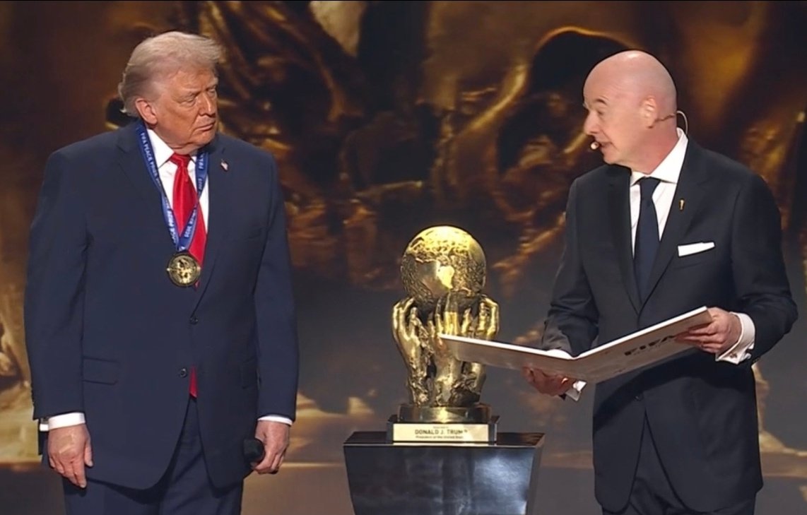 Donald Trump (left) hears the official citation read out by FIFA president Gianni Infantino
